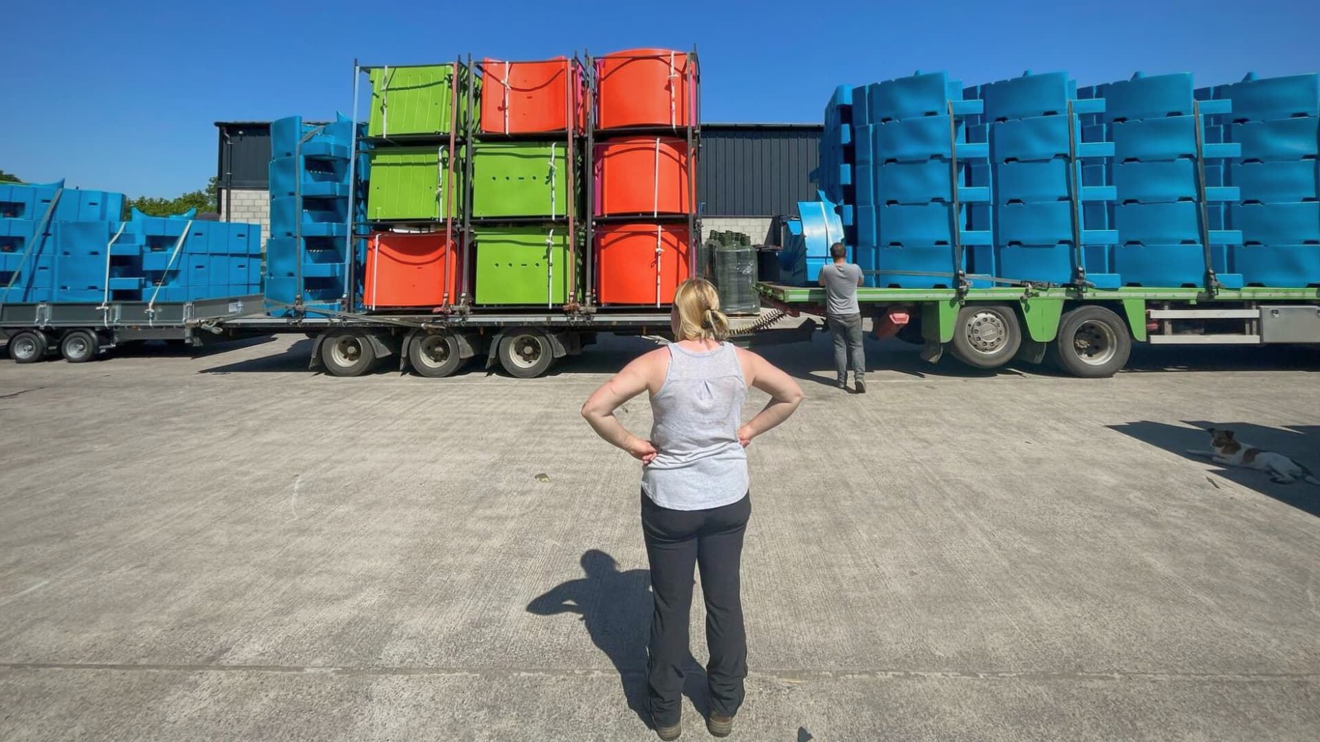 Amber Probyn looking at PEEQUAL stacked onto a haulage lorry.